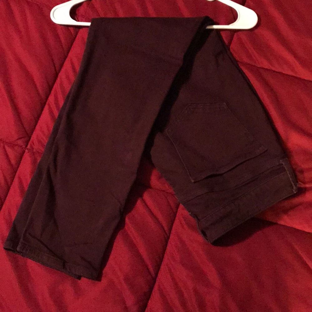 Burgundy skinny ankle pants.